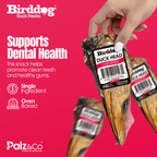 Birddog Duck Neck snack packaging with a hand holding it against a pink background