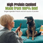 Person holding a treat for a dog on a teal couch with text about high protein content and brand 'Palz & Co'.
